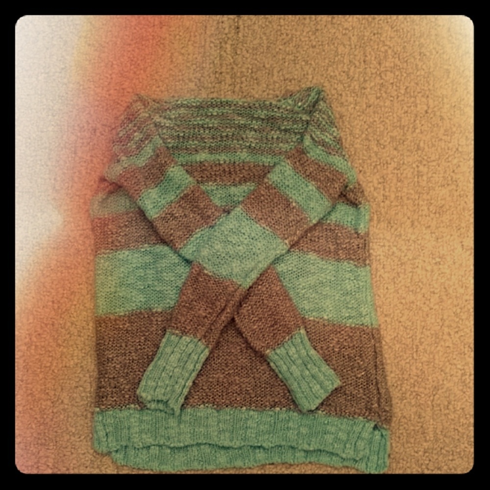 A grey and blue stripped turtle neck